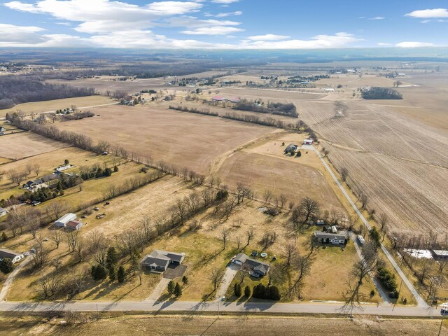 birds eye view of property with a rural view