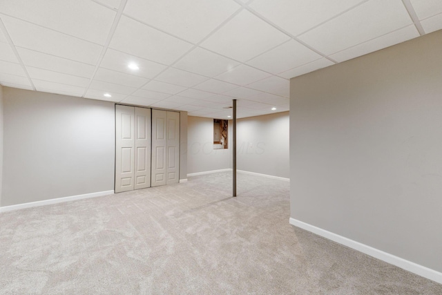 finished basement with recessed lighting, carpet flooring, a drop ceiling, and baseboards