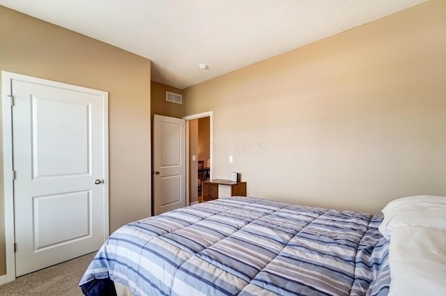 carpeted bedroom with visible vents