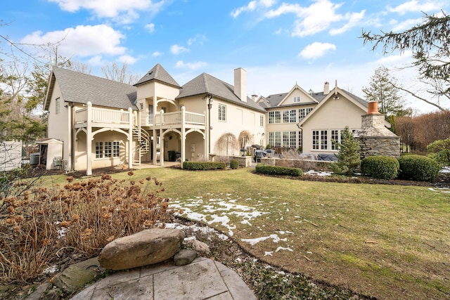 back of house featuring a patio area, a wooden deck, stairs, and a yard