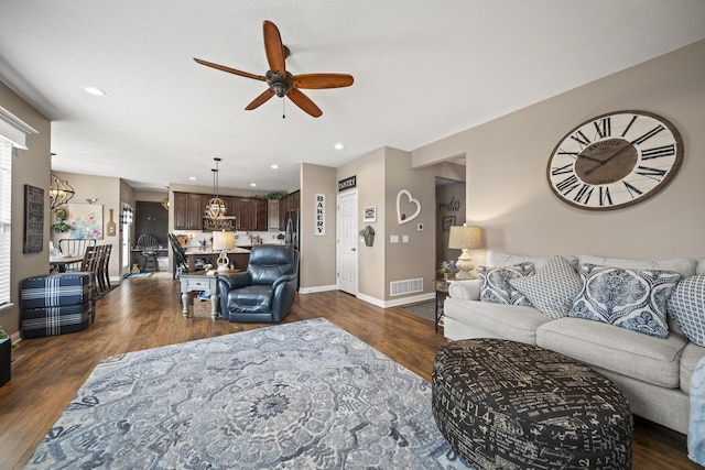 living room with dark wood-style flooring, recessed lighting, visible vents, a ceiling fan, and baseboards