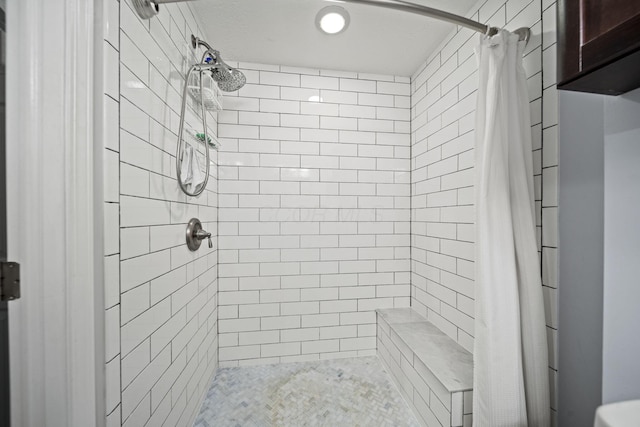 bathroom featuring a stall shower