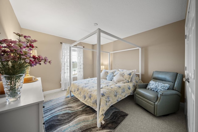 carpeted bedroom with baseboards