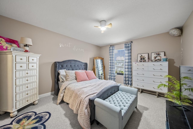 carpeted bedroom featuring baseboards