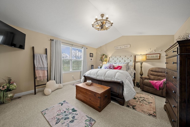 carpeted bedroom with baseboards, vaulted ceiling, and a notable chandelier