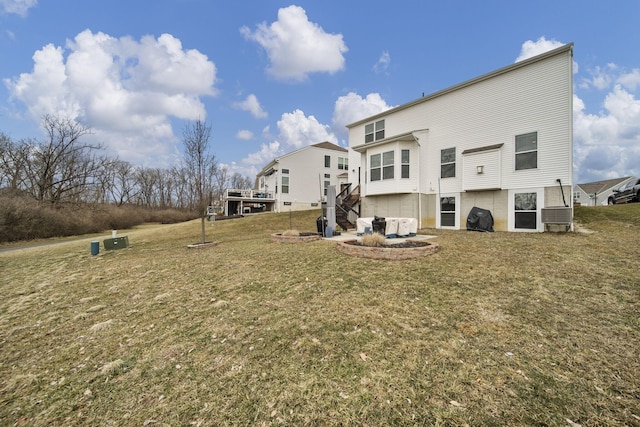 rear view of house with a lawn