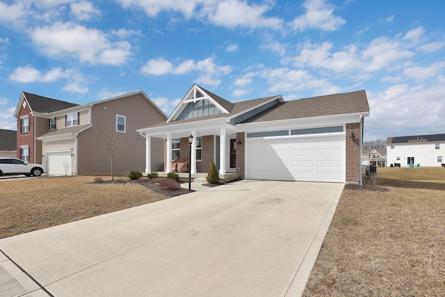 view of front of home with brick siding, covered porch, an attached garage, board and batten siding, and driveway