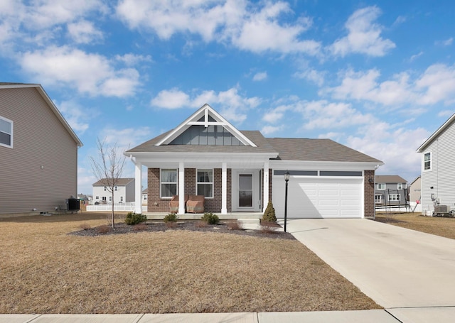 craftsman inspired home with driveway, an attached garage, a porch, board and batten siding, and brick siding