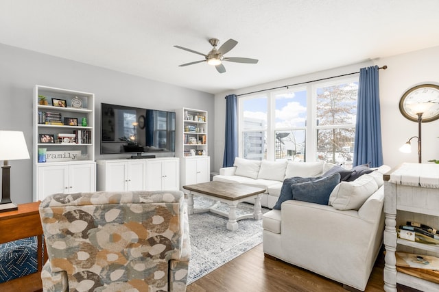 living room with dark wood-style floors and ceiling fan