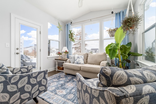 sunroom featuring lofted ceiling