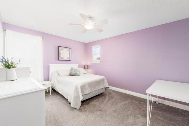 bedroom featuring light carpet, baseboards, and a ceiling fan