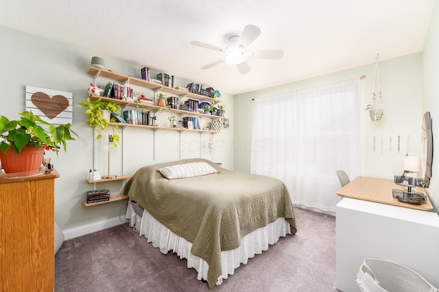 bedroom with carpet, baseboards, and a ceiling fan