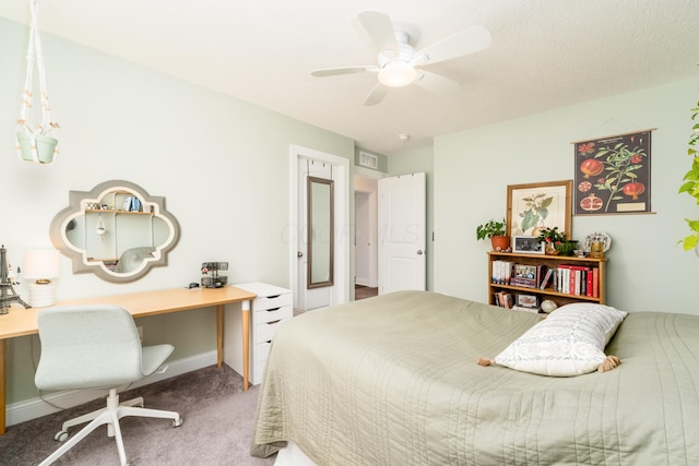 carpeted bedroom with a ceiling fan and baseboards