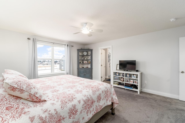 bedroom with carpet, baseboards, ceiling fan, and a textured ceiling