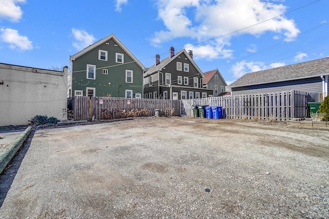 back of property featuring fence