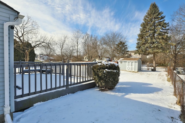 exterior space with an outbuilding, a deck, and a shed