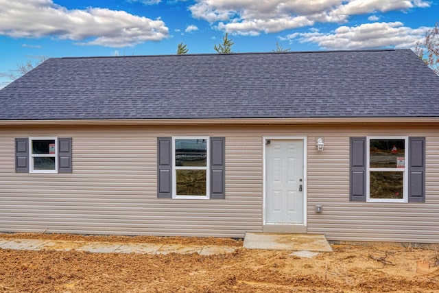 view of front of property with roof with shingles