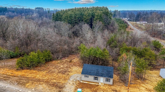 aerial view featuring a view of trees