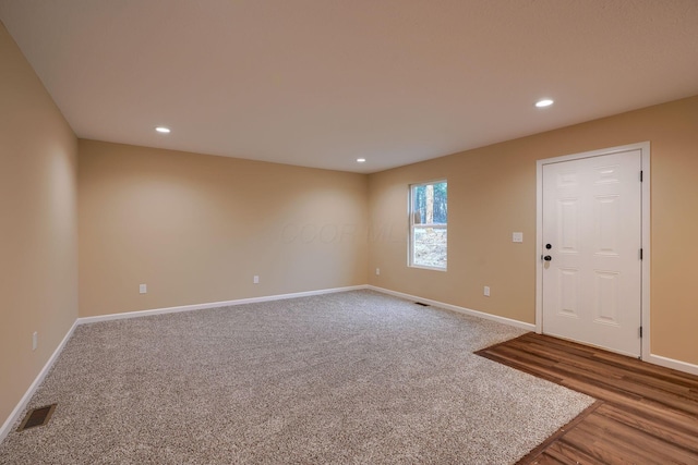 interior space with recessed lighting and baseboards