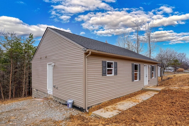 view of property exterior featuring roof with shingles