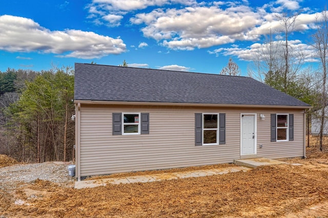 view of front of home with a shingled roof