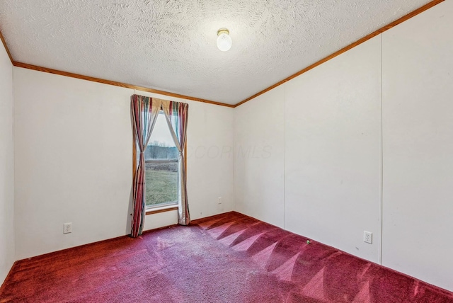 spare room with a textured ceiling, carpet floors, and ornamental molding