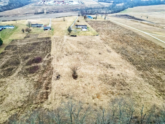 birds eye view of property featuring a rural view