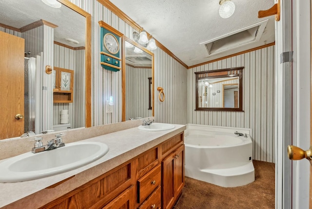 full bath with a textured ceiling, a sink, a garden tub, and wallpapered walls