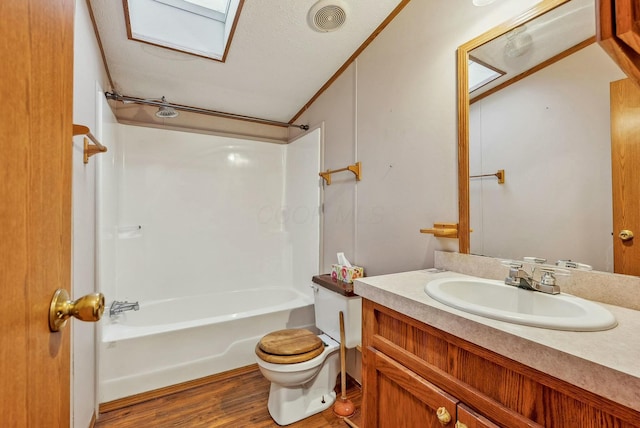 full bath featuring shower / bathtub combination, visible vents, toilet, vanity, and wood finished floors