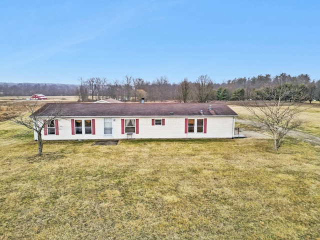 ranch-style home with a front lawn