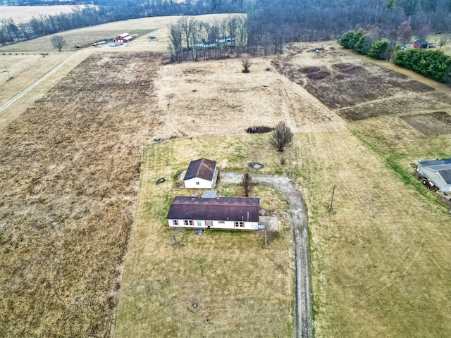 birds eye view of property with a rural view