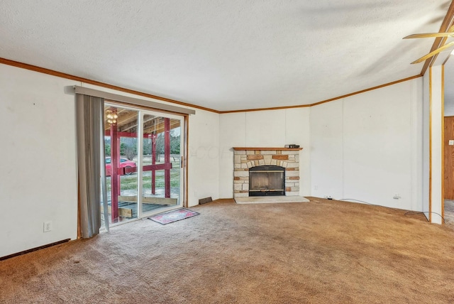 unfurnished living room featuring ornamental molding, carpet flooring, a stone fireplace, and a textured ceiling