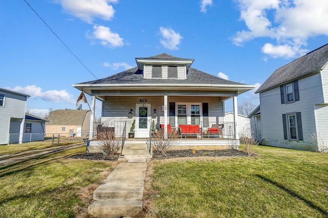 bungalow-style home with a porch, a front yard, fence, and a shingled roof