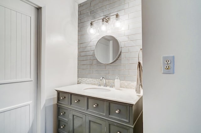 bathroom with backsplash and vanity