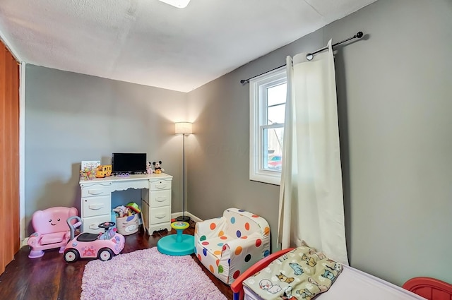 bedroom featuring wood finished floors