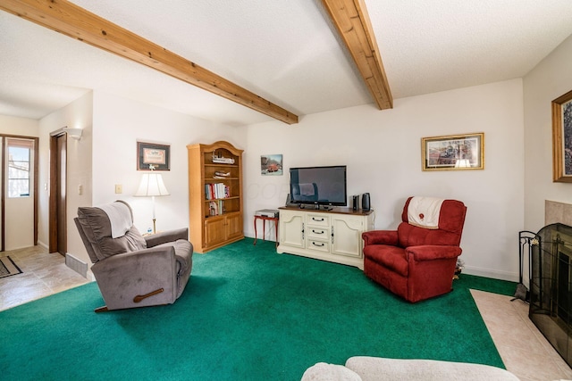 carpeted living room featuring baseboards, visible vents, a fireplace with flush hearth, beamed ceiling, and a textured ceiling