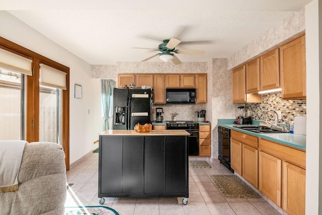 kitchen with decorative backsplash, a center island, a sink, and black appliances