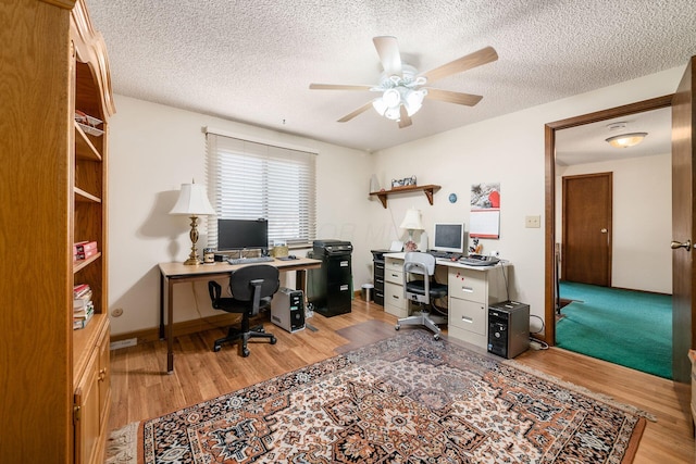 office space featuring a textured ceiling, wood finished floors, and a ceiling fan