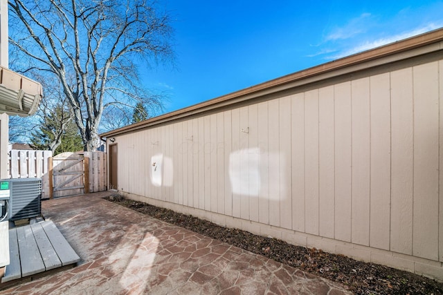 exterior space with a patio area, a gate, and fence