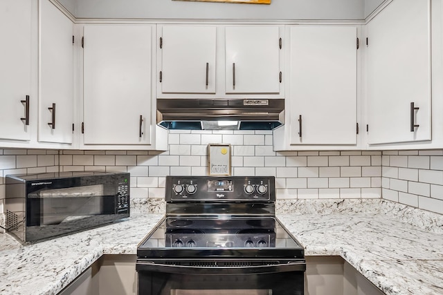 kitchen with black appliances, under cabinet range hood, and white cabinets