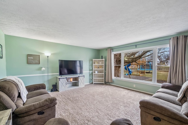 carpeted living room with baseboards and a textured ceiling