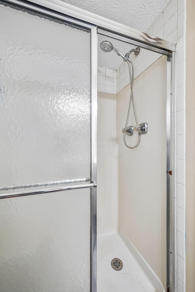 bathroom featuring a stall shower