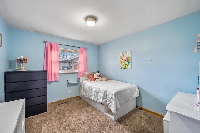 carpeted bedroom with baseboards and visible vents
