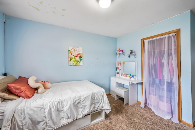 bedroom featuring baseboards and carpet flooring