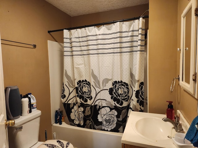 full bathroom featuring shower / tub combo with curtain, a textured ceiling, toilet, and vanity