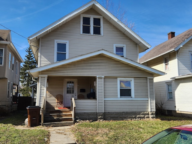 traditional style home featuring covered porch