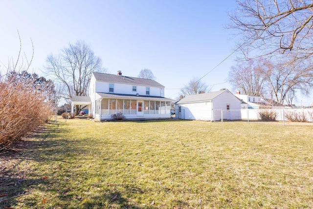 back of house featuring a chimney, fence, a porch, and a yard