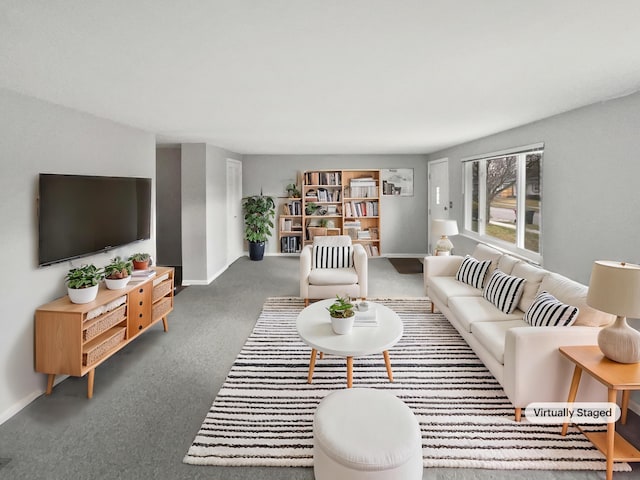 living area featuring carpet and baseboards