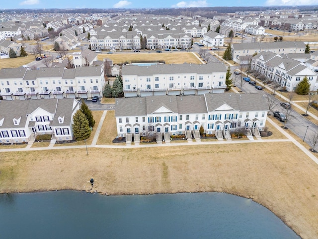 aerial view with a water view and a residential view