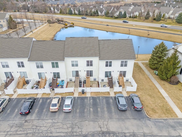 bird's eye view featuring a water view and a residential view